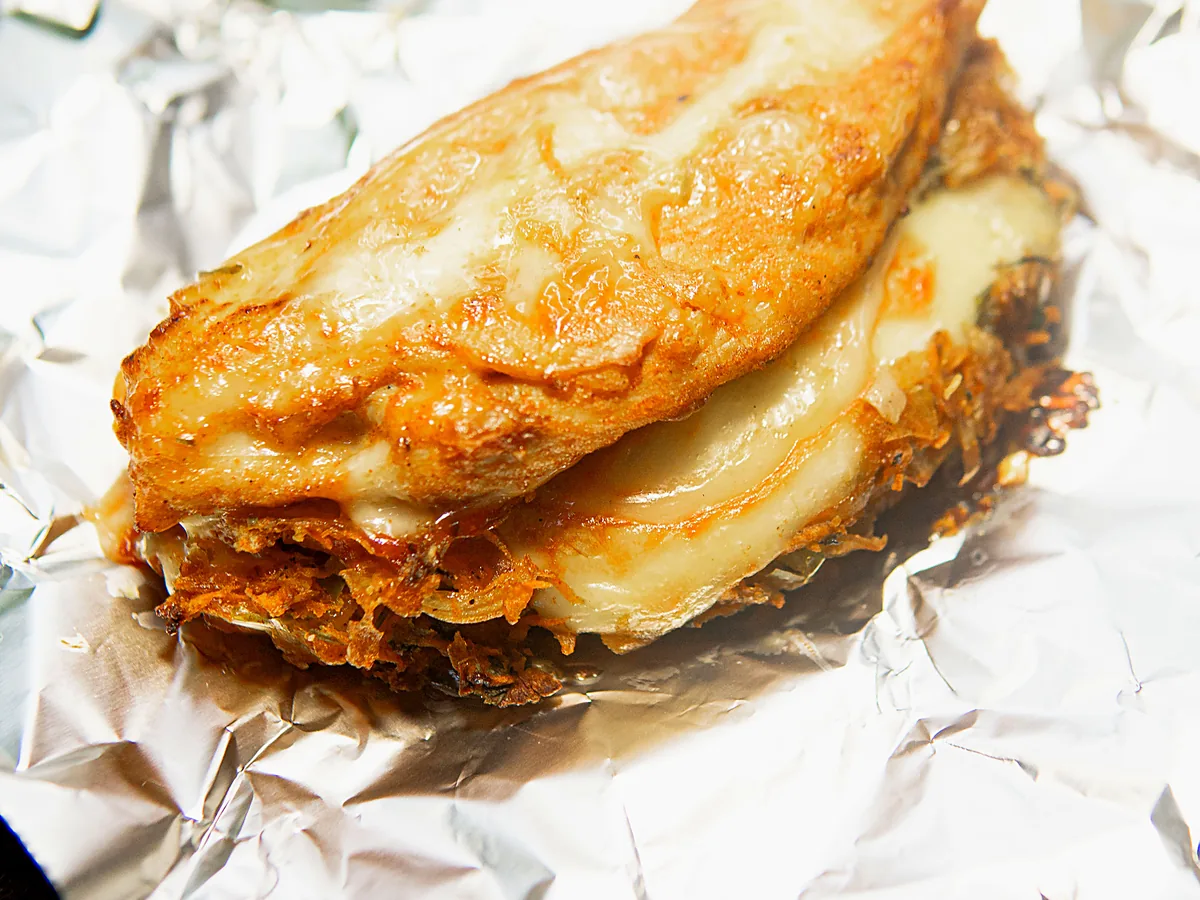 Chicken Melt cut open on foil